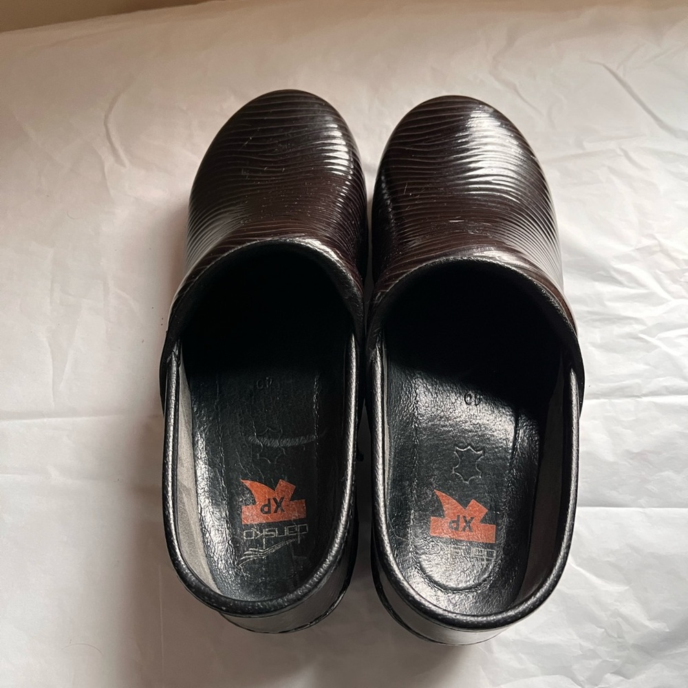 Dansko XP clogs.